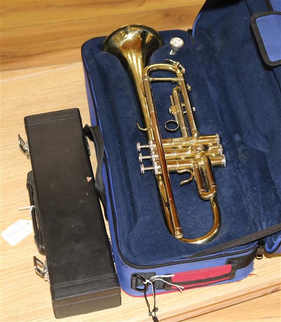 A boxed trumpet and a flute